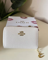 Coach Pebbled Leather Zip Around Wallet - white