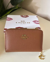 Coach Pebbled Leather Zip Around Wallet - brown