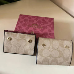 Coach Leather bi-fold wallet w/ two zippered pockets