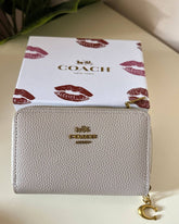 Coach Pebbled Leather Zip Around Wallet - beige