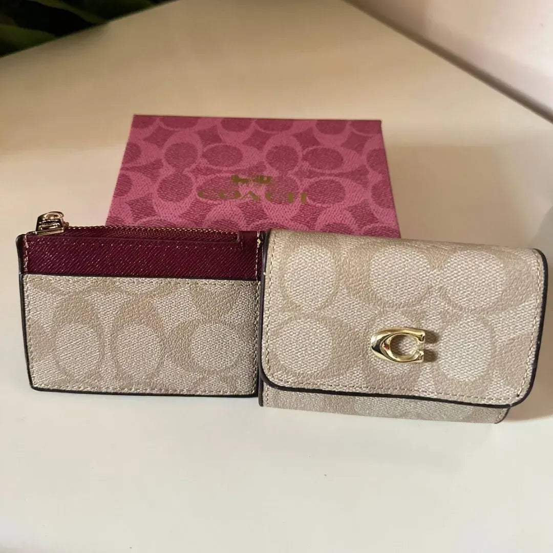 Coach Leather bi-fold wallet w/ two zippered pockets