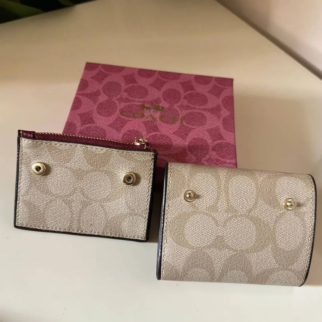 Coach Leather bi-fold wallet w/ two zippered pockets
