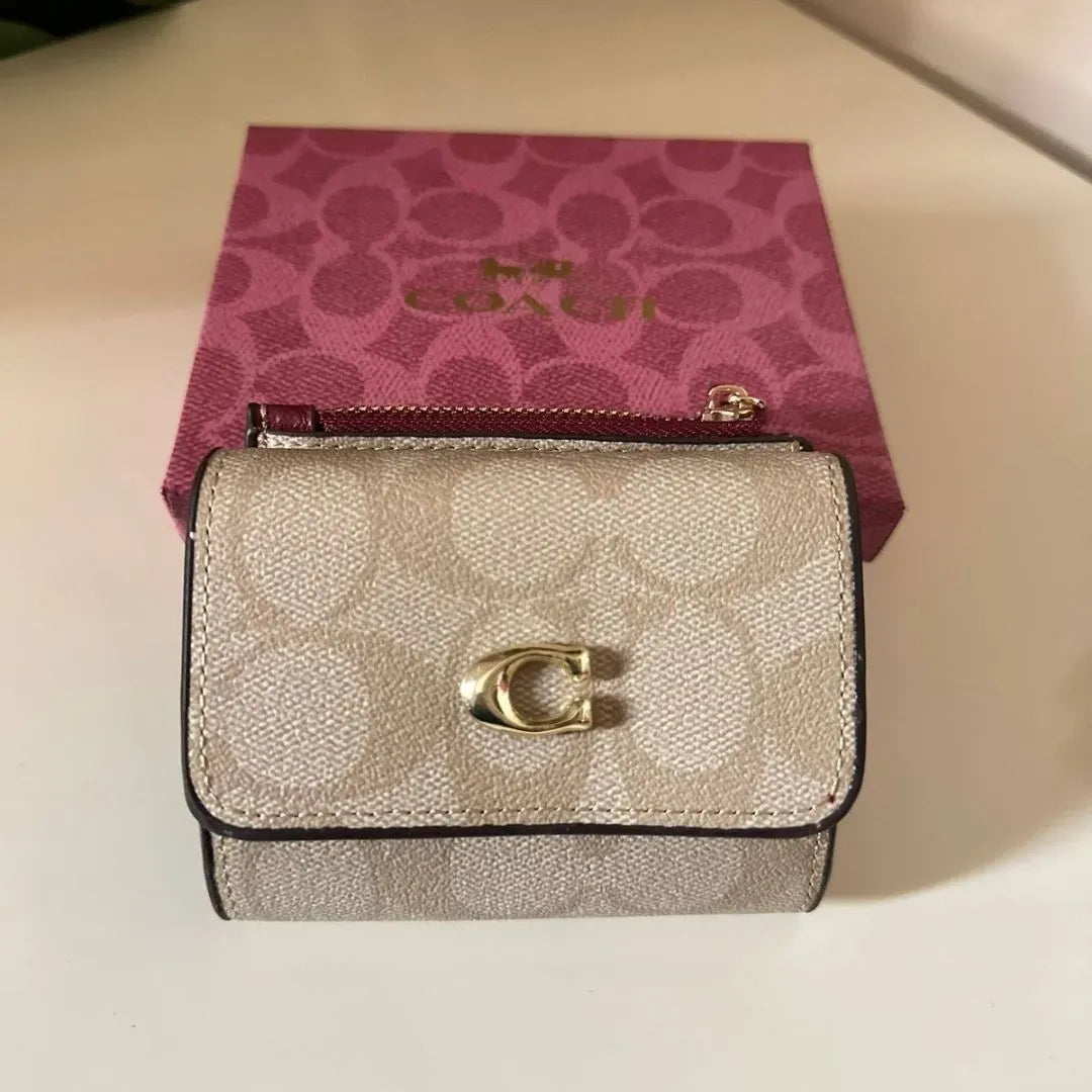 Coach Leather bi-fold wallet w/ two zippered pockets