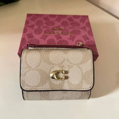 Coach Leather bi-fold wallet w/ two zippered pockets