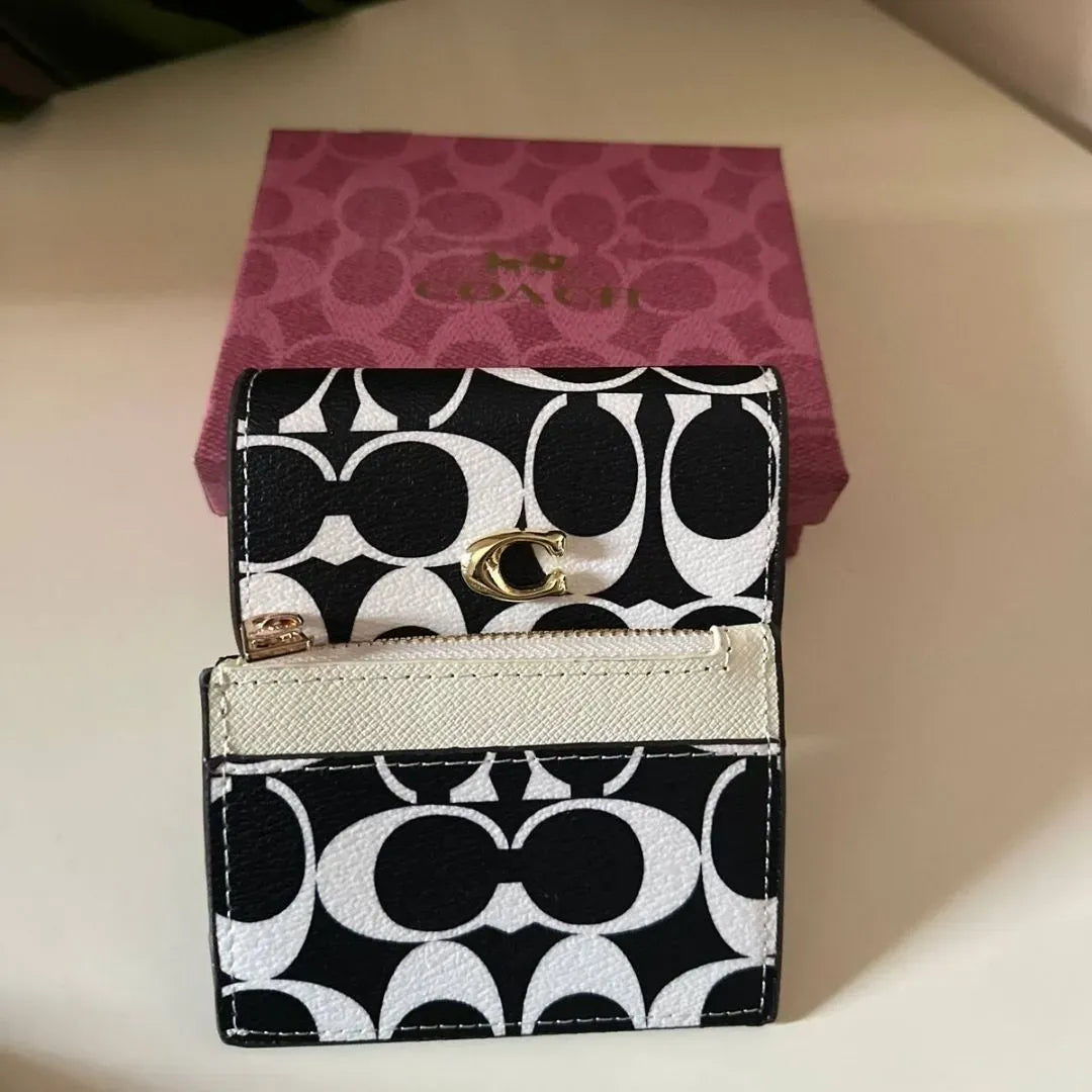 Coach Wallet in black & white Signature Canvas